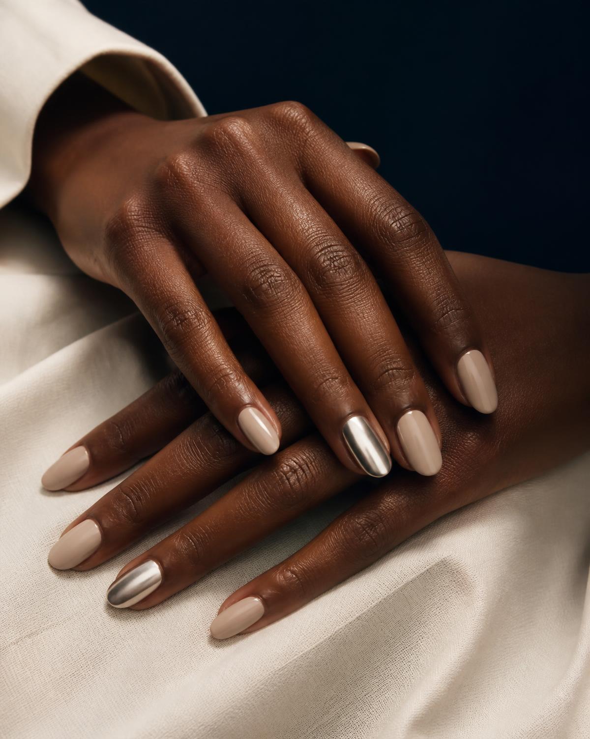 Neutral chrome-accent manicure at a luxury Metro Detroit beauty studio